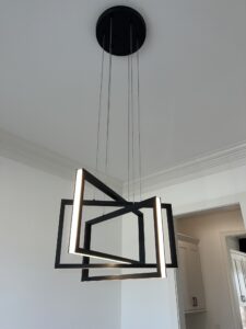 A chandelier hanging from the ceiling in a room.