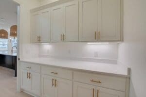 closeup shot of white cabinets in a kitchen