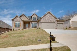 Brick house with a two-car garage.